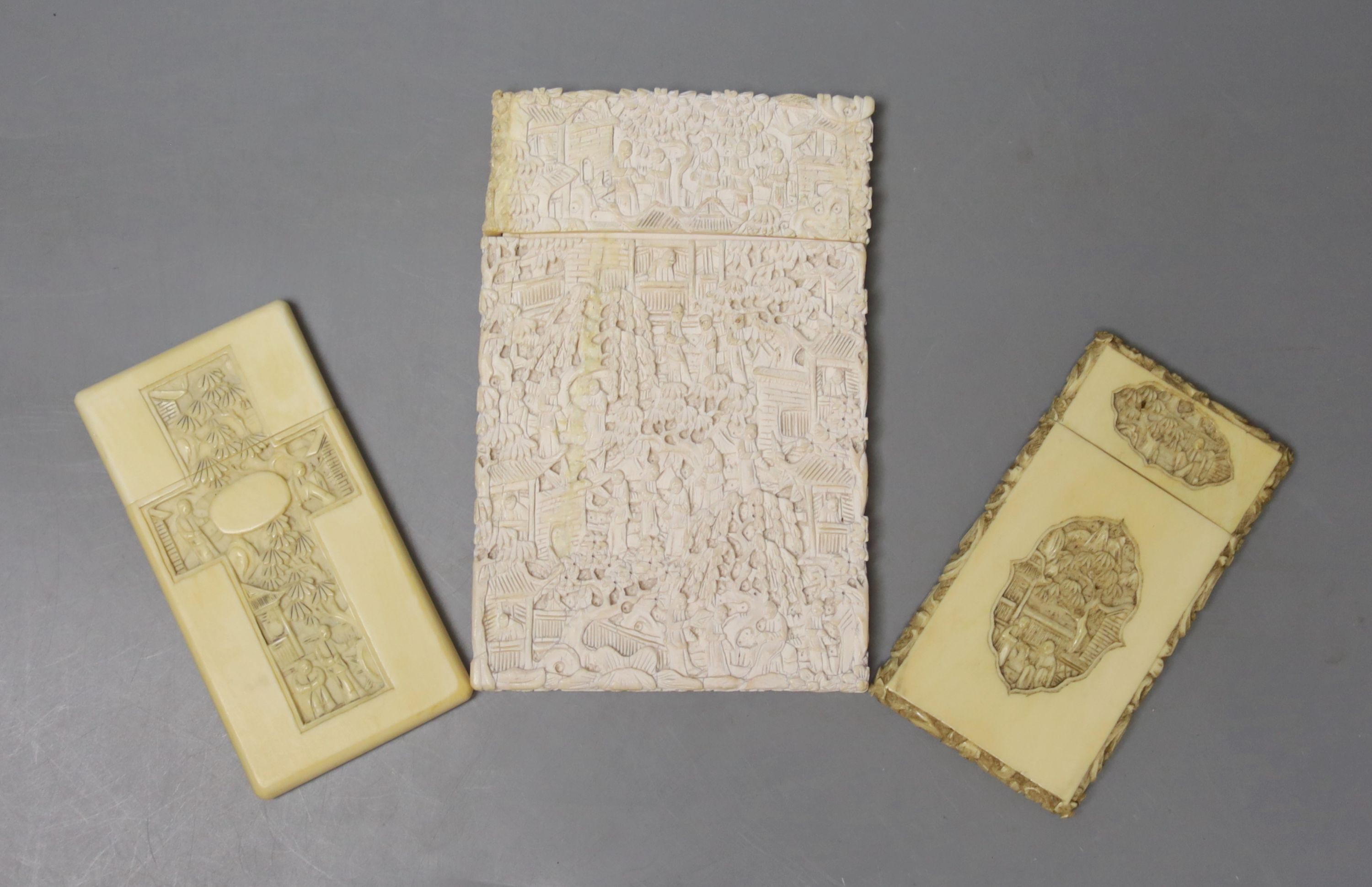 Two Chinese carved ivory card cases, largest 12 x 8cm